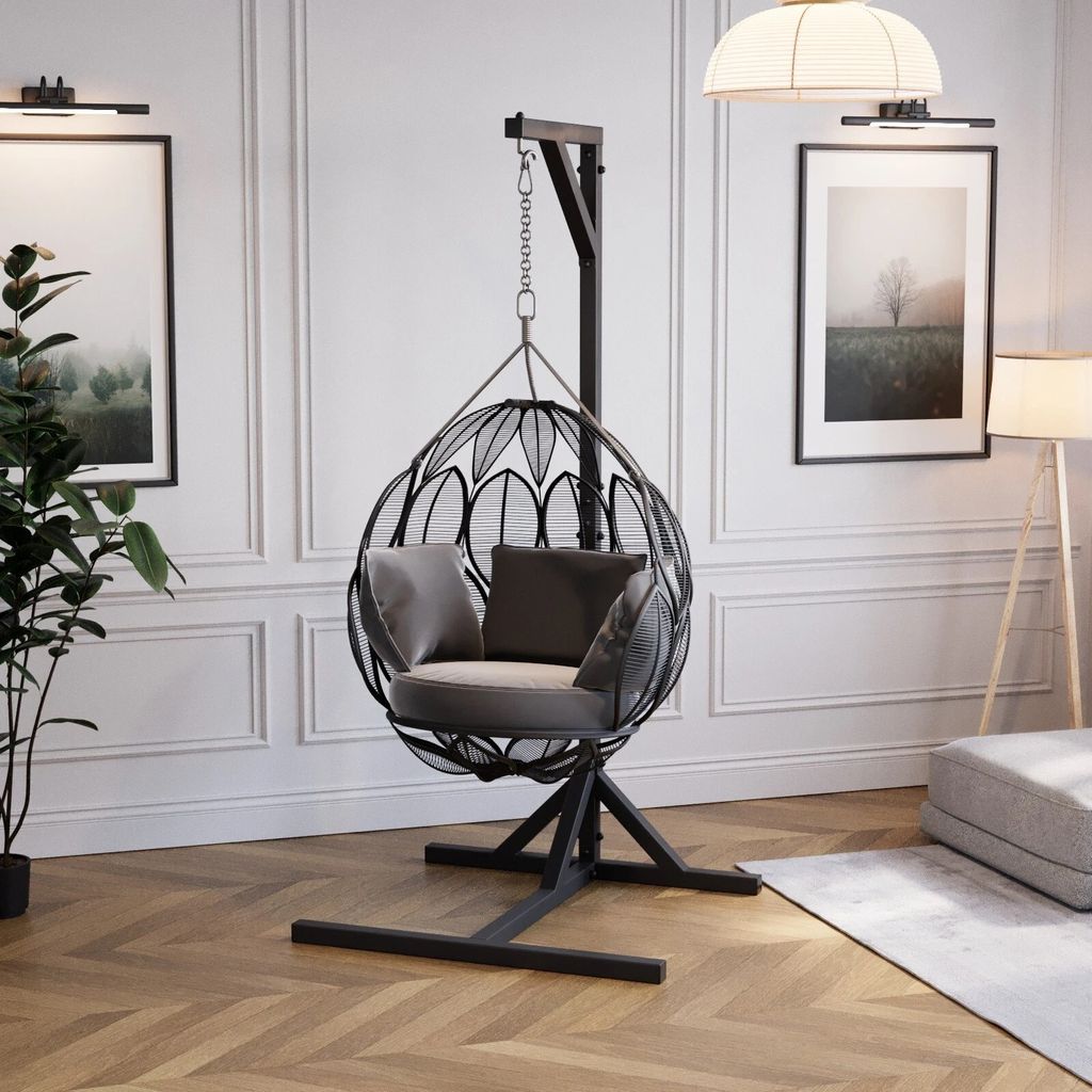 A modern living room with a hanging chair.