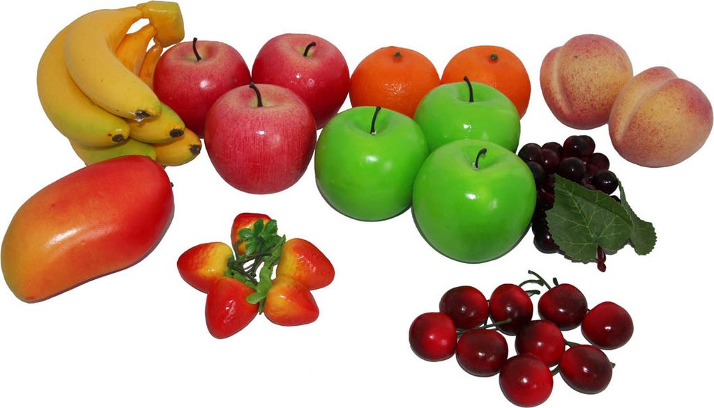 A collection of artificial fruits arranged on a white background.