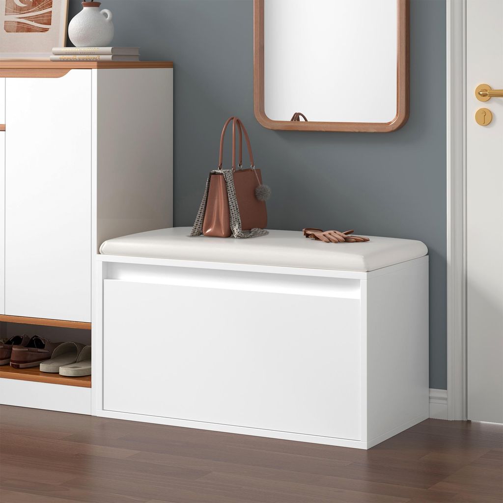 An entryway with a shoe cabinet and a bench.