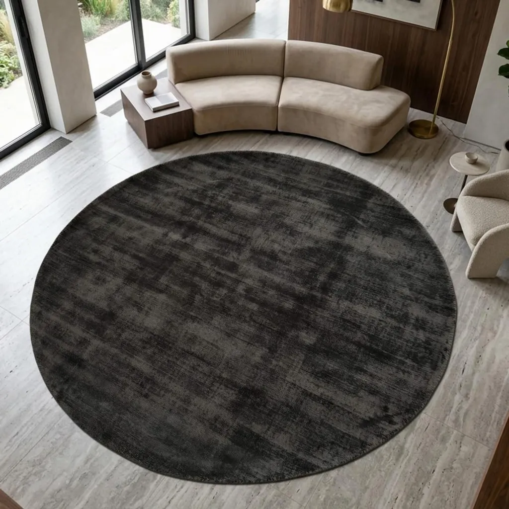 Grand tapis de salon rond noir fait main Unidesign pour votre déco