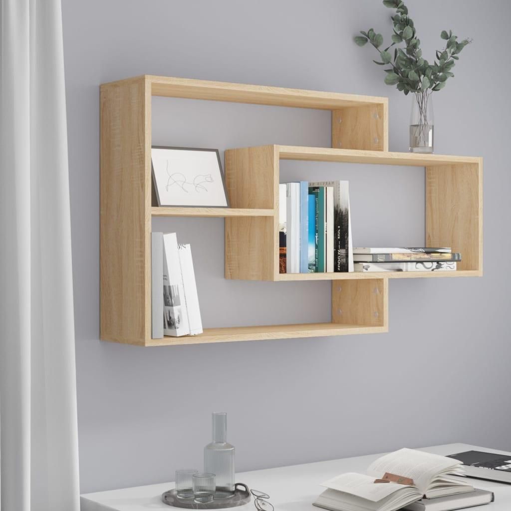 A wooden wall shelf with books and a framed picture.