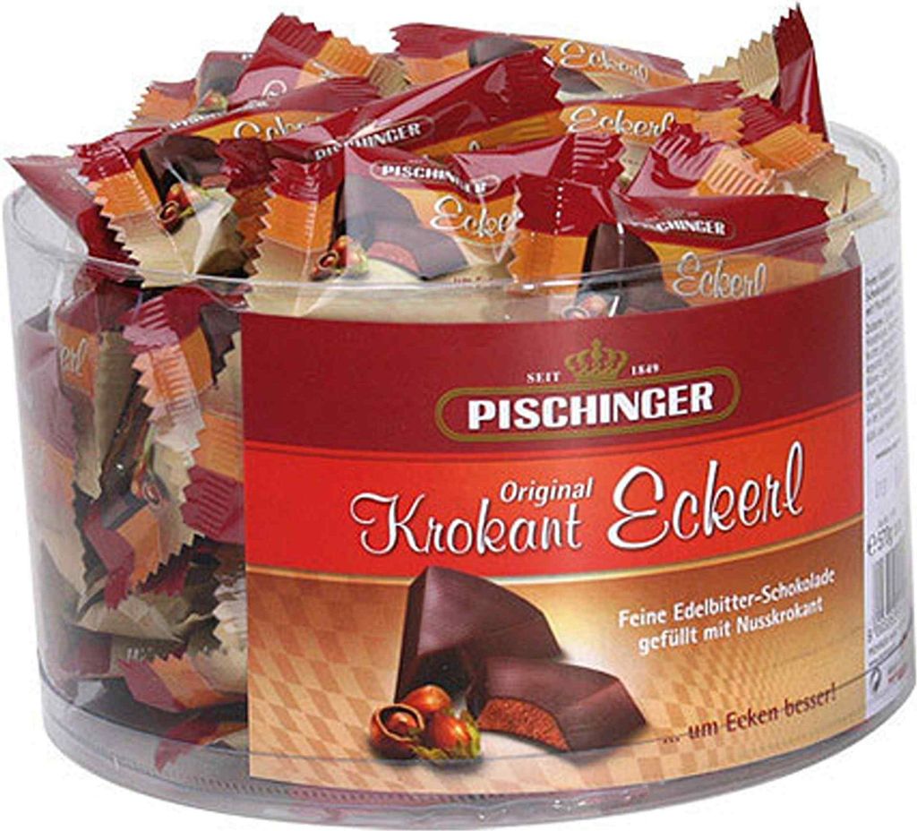 A clear, well-lit image of a round plastic container filled with individually wrapped chocolates.