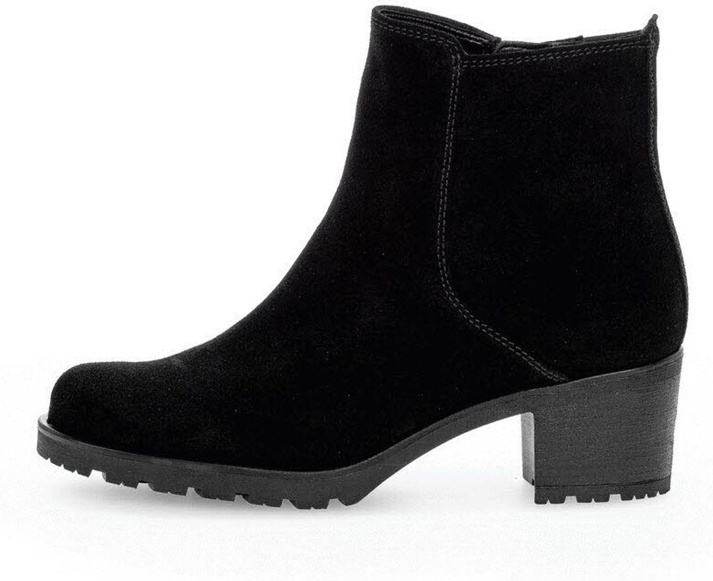 A black suede boot with a block heel is shown from the side against a white background.