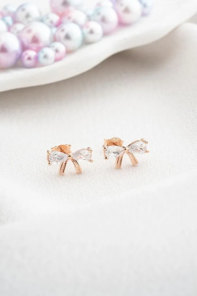 Puces d'oreilles nœud argent 925 et zircone pour femme en or rose chic