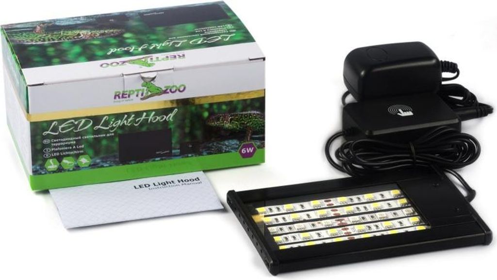 A product box, instruction manual, and LED light hood with its power adapter are displayed.