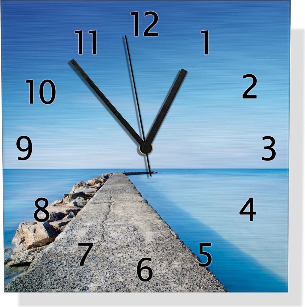 Wallario Design Wanduhr Pier am blauen Ozean mit blauem Himmel aus Aluverbund, Größe 30 x 30 cm