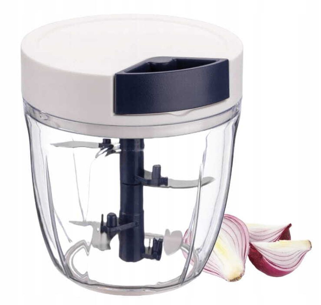 A manual food chopper with red onion slices next to it.
