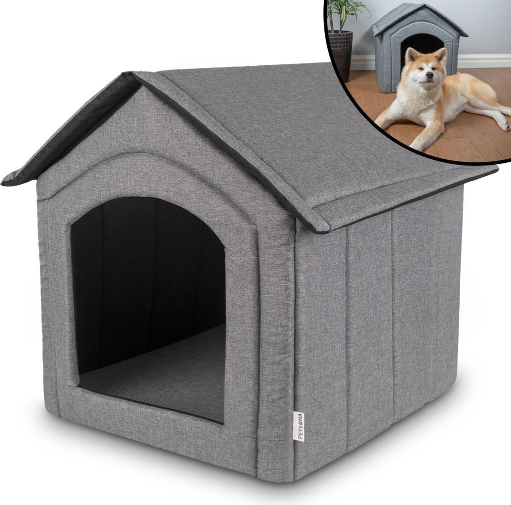 A gray fabric dog house with an arched entrance.