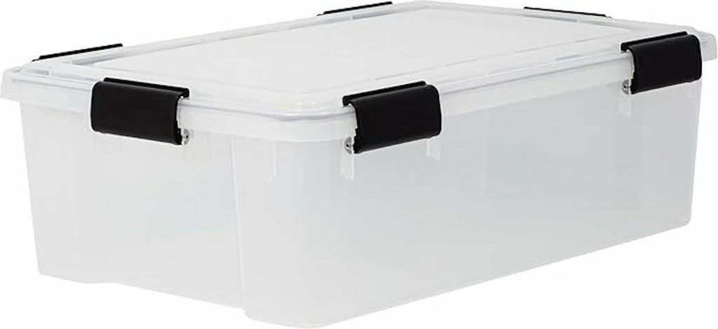 A clear studio shot of a transparent storage box with black clips.