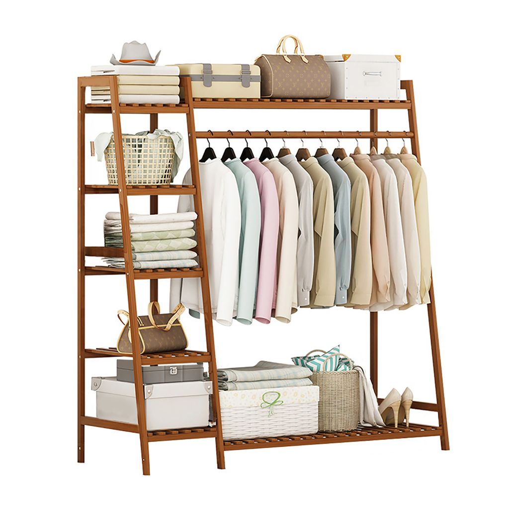 A wooden garment rack with shelves and hanging clothes.