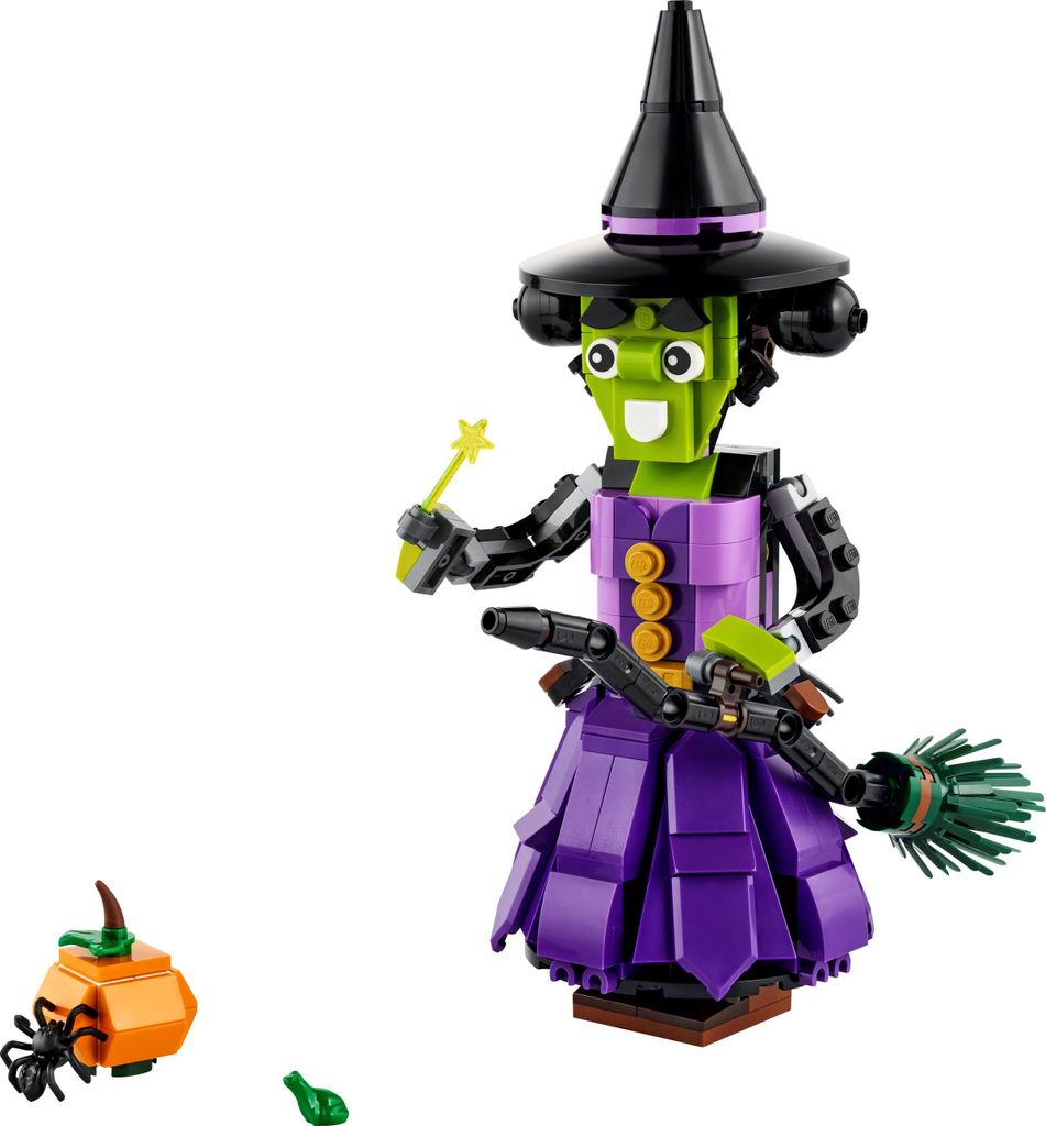 A LEGO witch figure with a broom and a small pumpkin accessory, set against a white background.