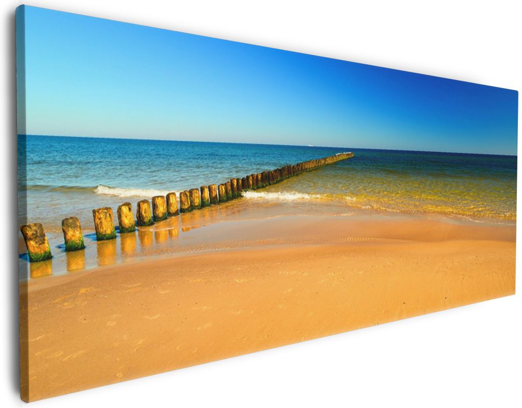 Wallario Premium Leinwandbild Sandstrand in orange - Blaues Meer - Blauer Himmel in Größe 60 x 150 cm