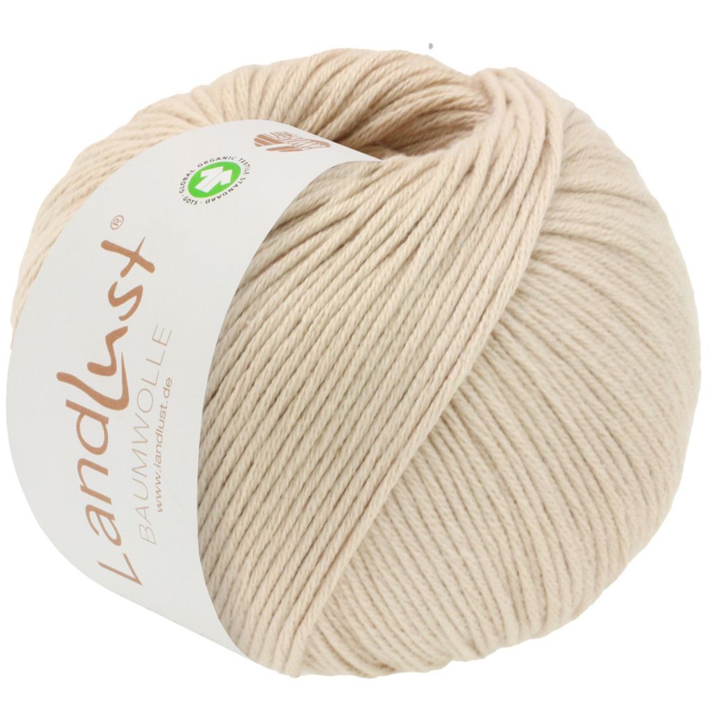 A ball of beige yarn with a label.