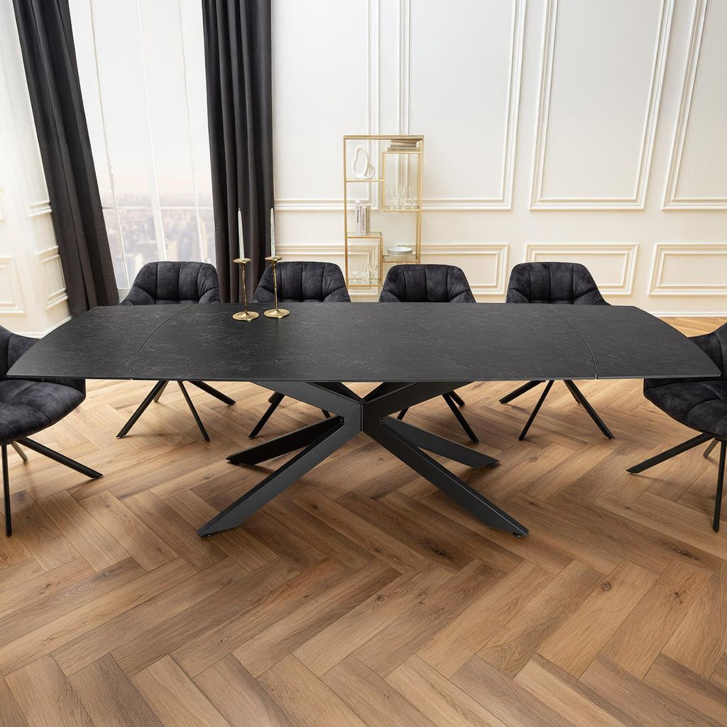 A dining table with chairs in a well-lit room.
