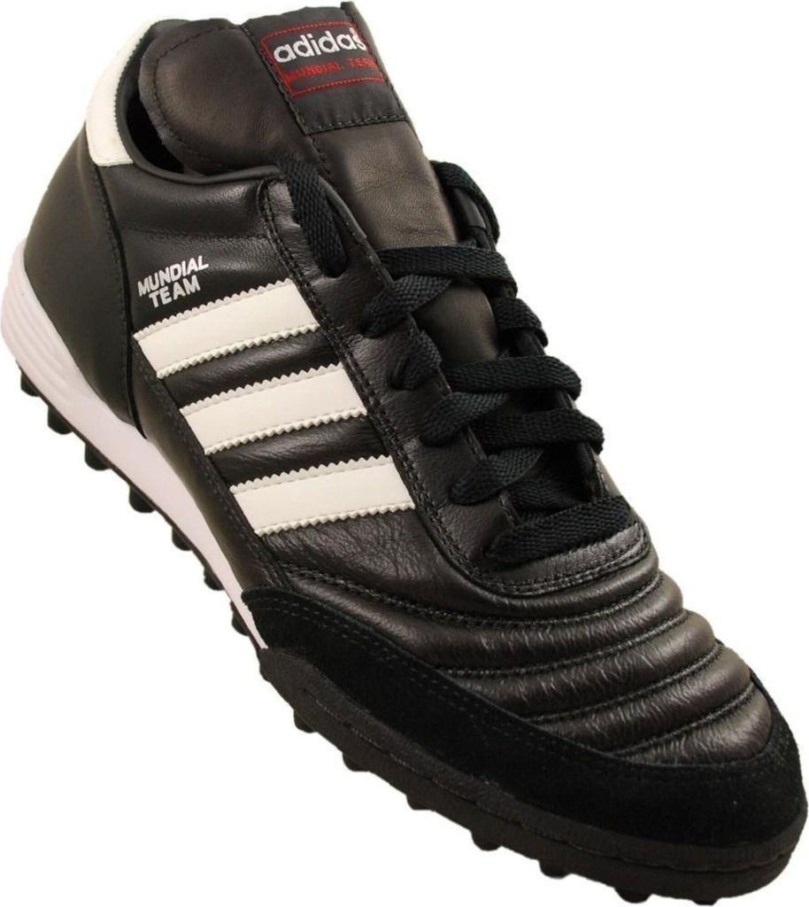 A black Adidas soccer shoe with white stripes and red accents.