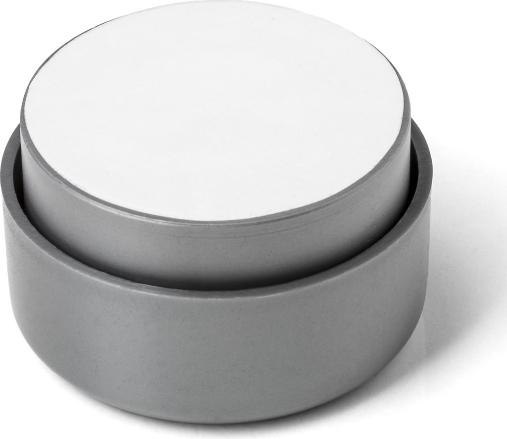 A close-up studio shot of a gray furniture foot with a white top.