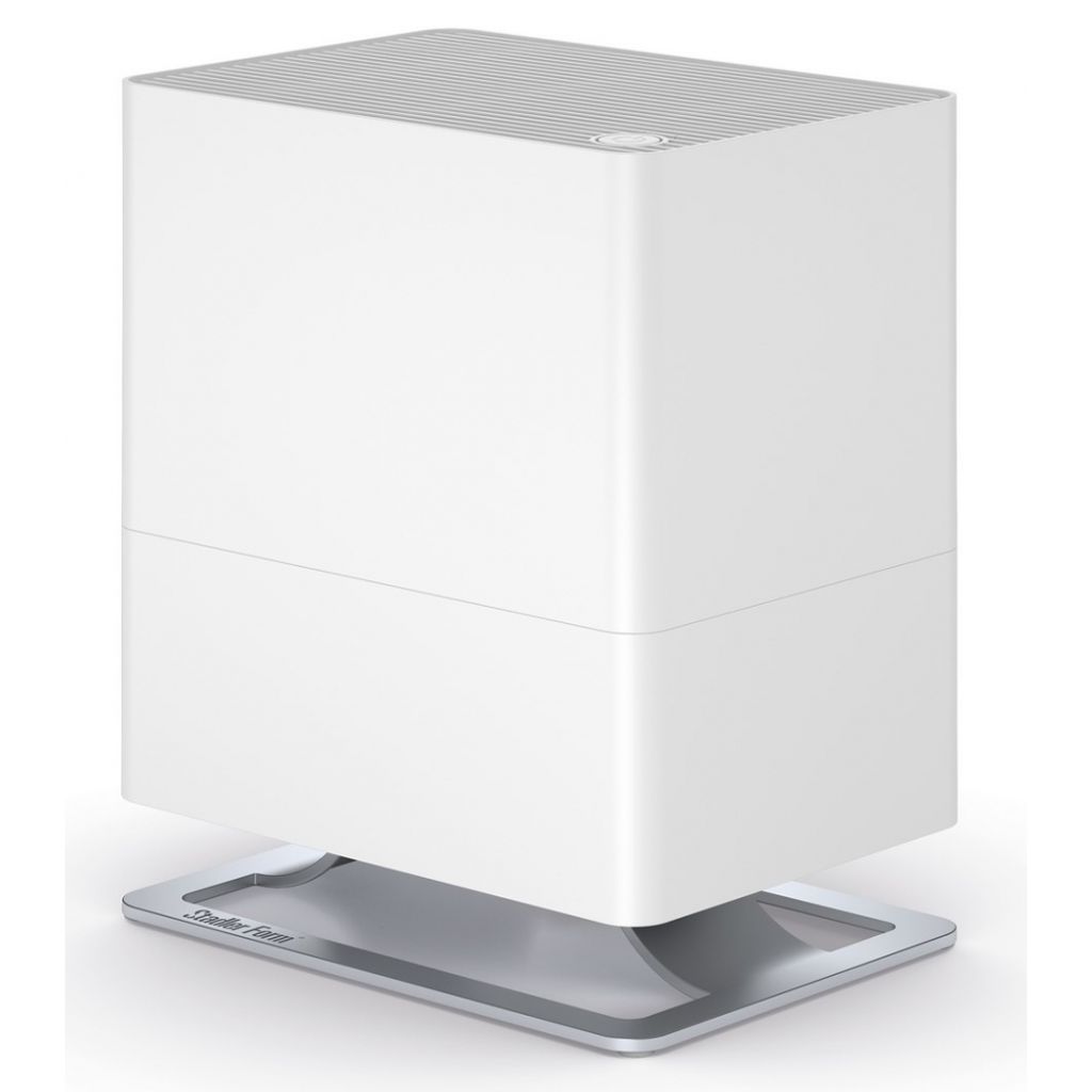 A white humidifier with a silver base, shown against a white background.
