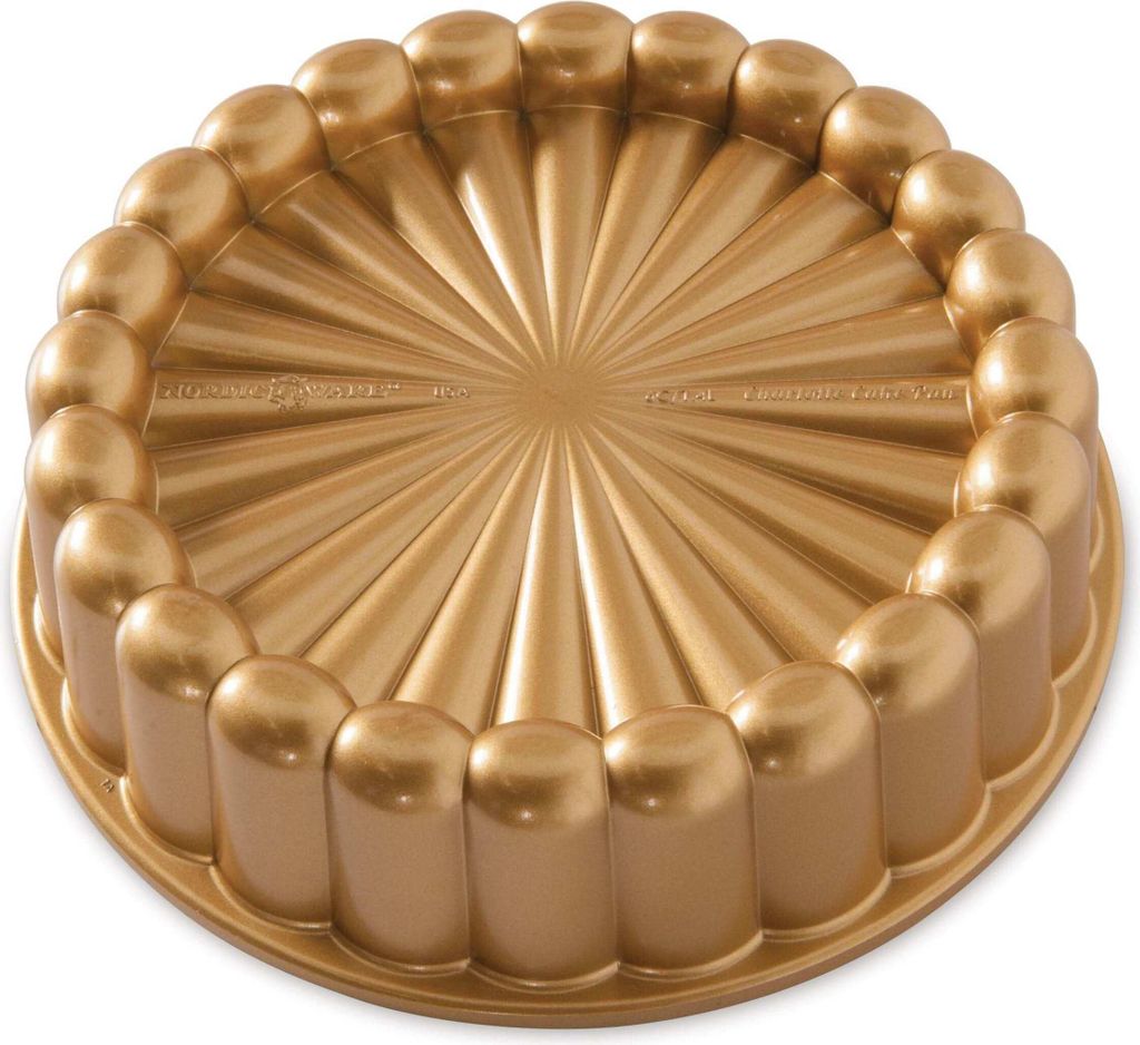 A gold-colored cake pan with a fluted design.