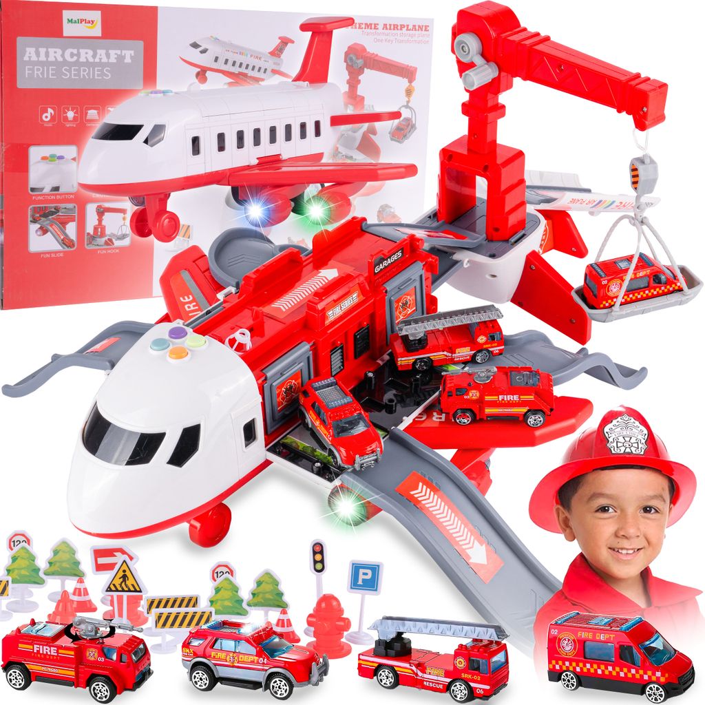 A toy airplane playset with fire trucks and accessories, with a child wearing a firefighter helmet in the foreground.