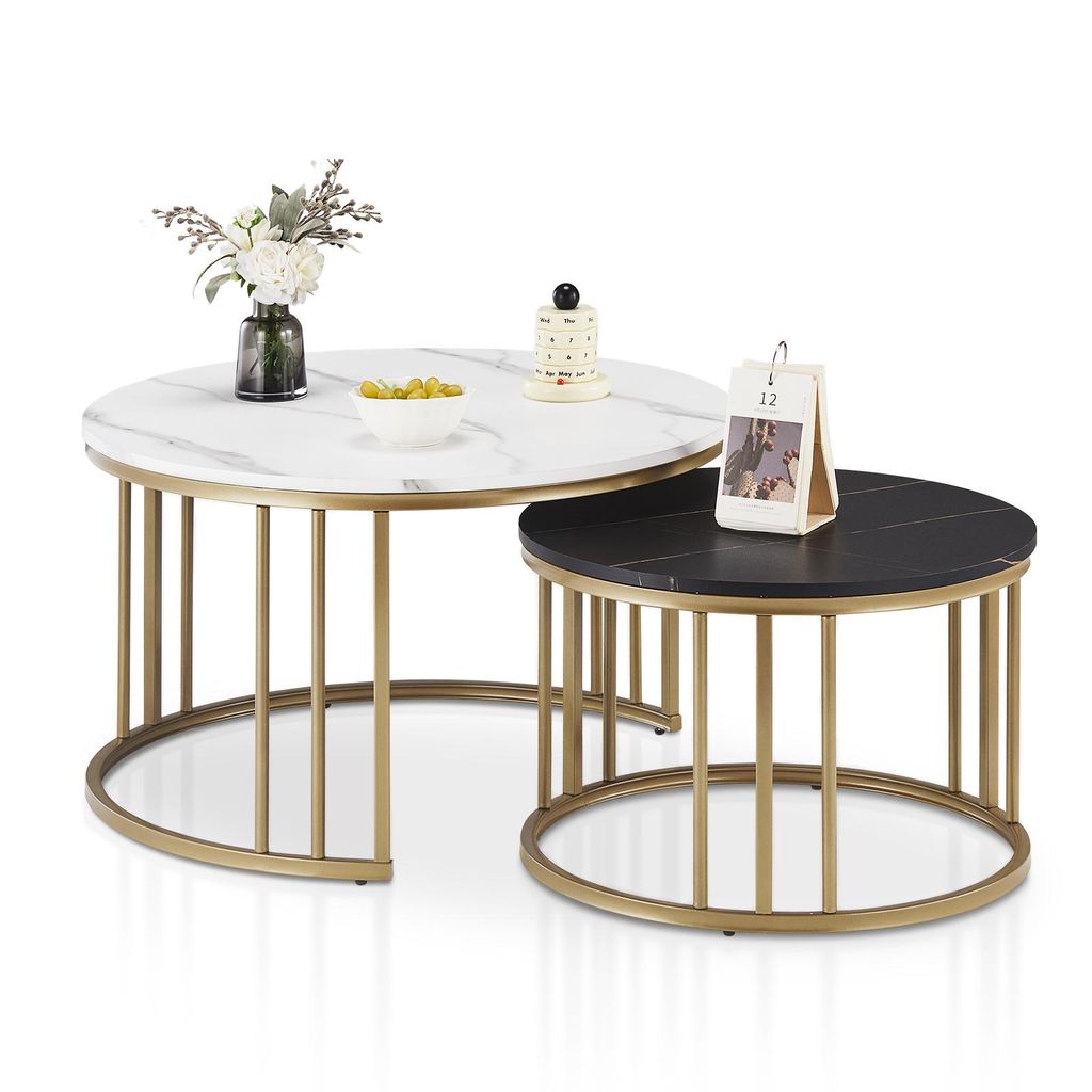Two round coffee tables, one white marble effect and one black marble effect, with gold metal frames, are displayed against a white background.