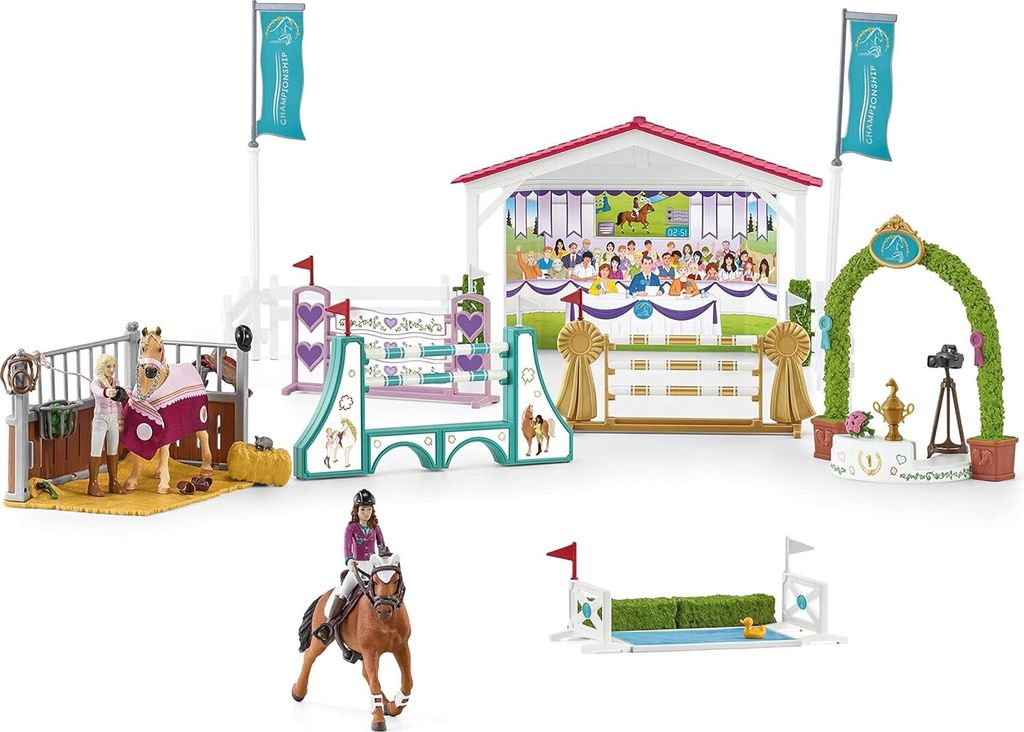 A collection of toy equestrian playsets and figures.