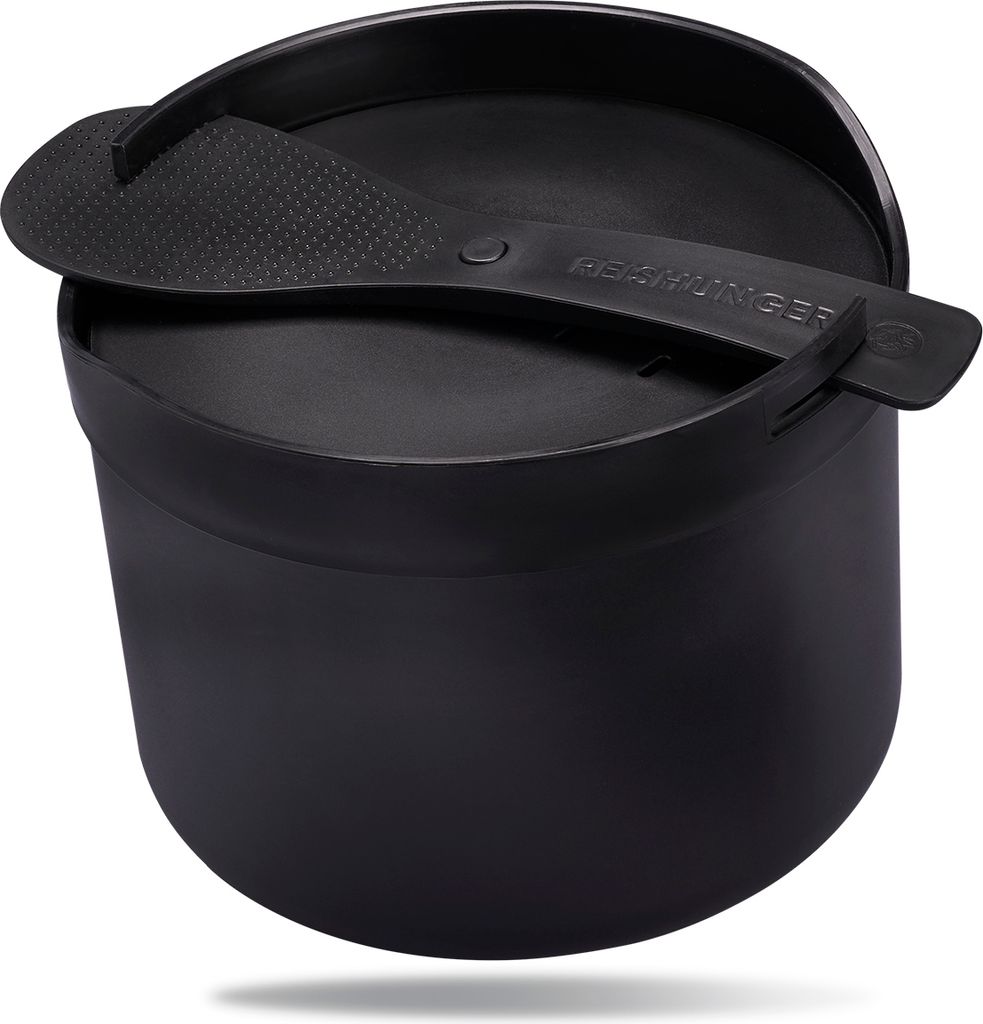 A black rice cooker with a lid and spoon resting on top, set against a white background.