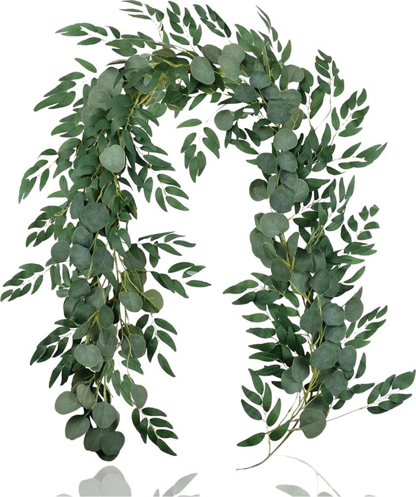 A close-up view of a green artificial plant garland.