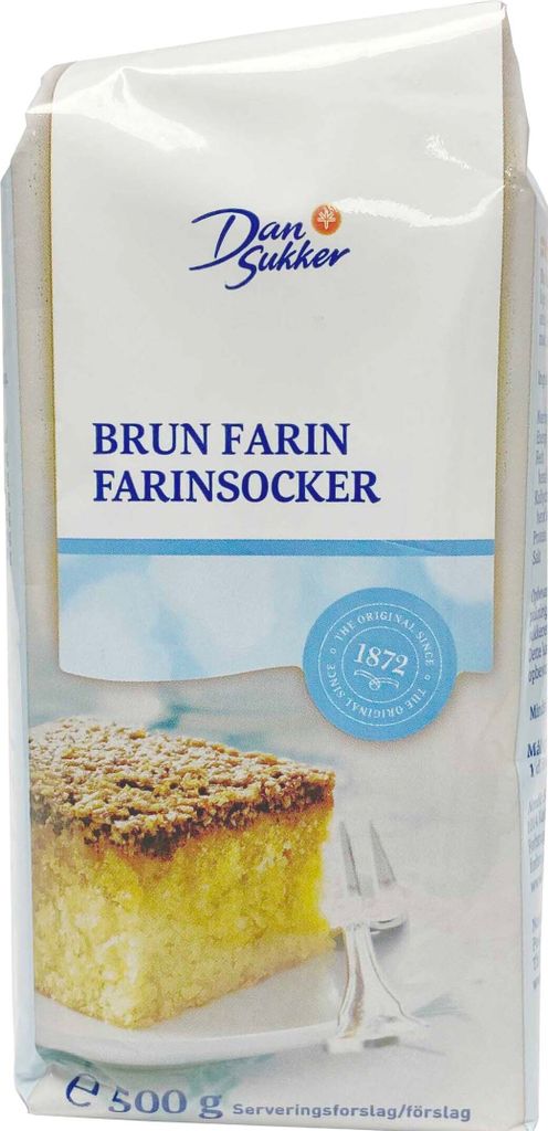A bag of brown sugar with a slice of cake on a plate.