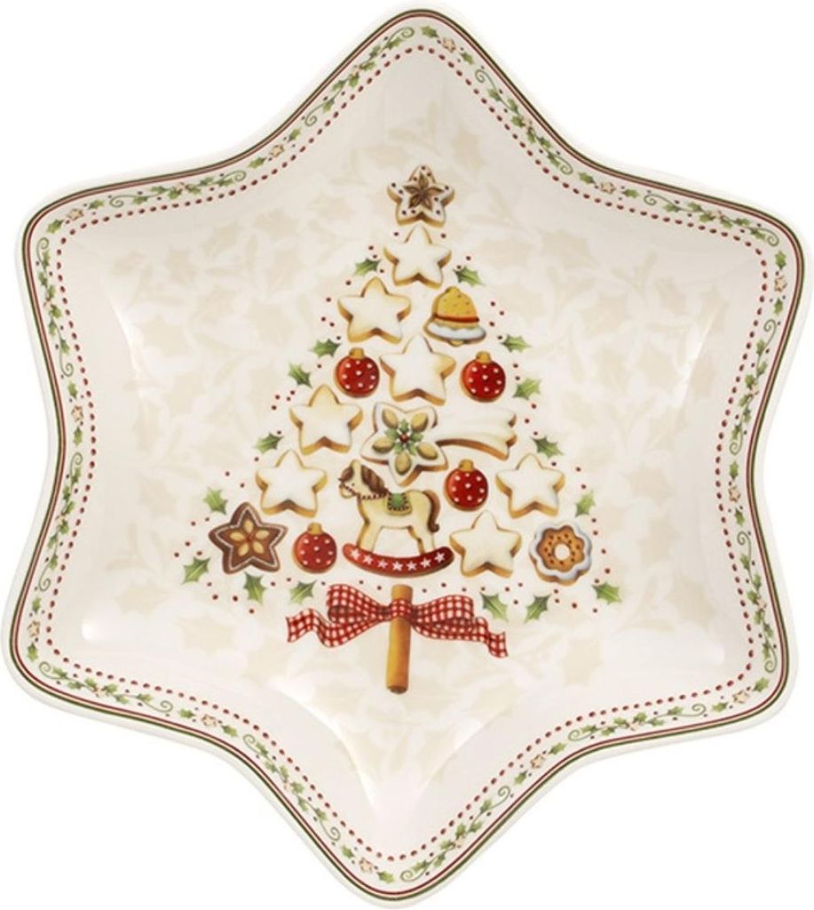 A star-shaped plate decorated with a Christmas tree made of cookies and ornaments.