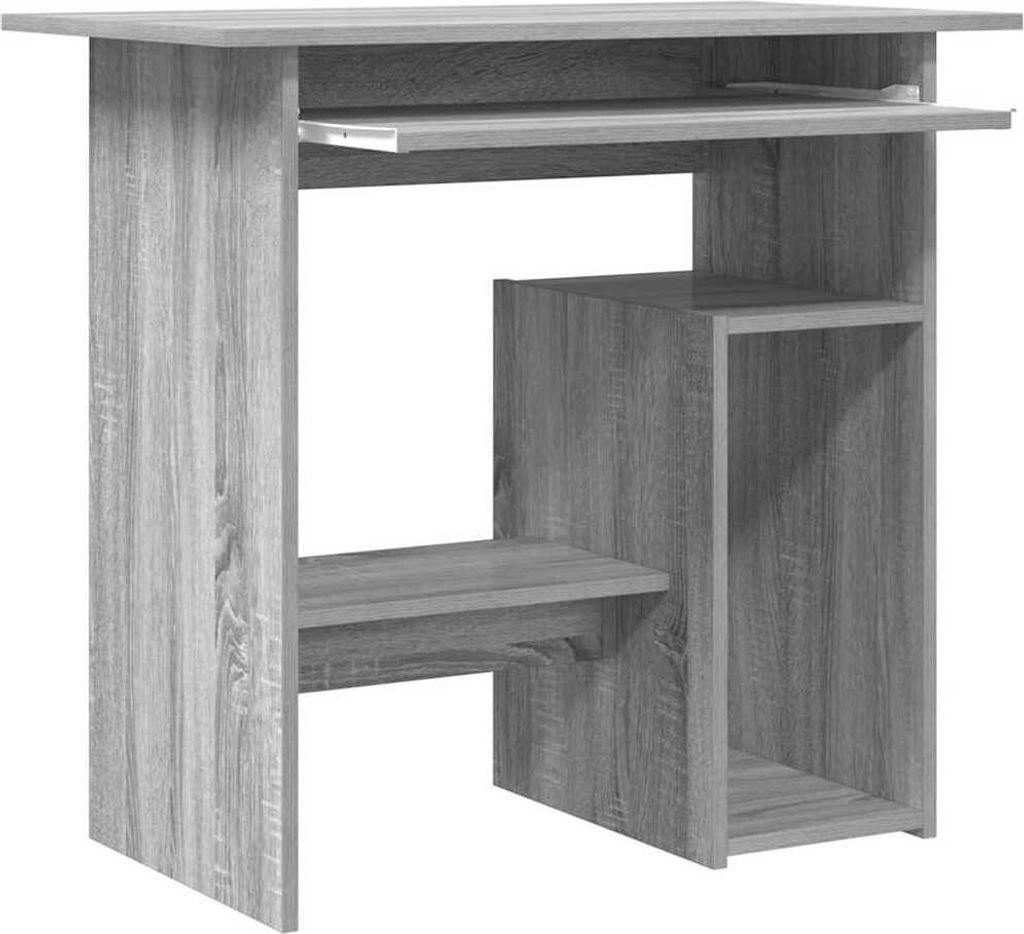 A gray wooden particleboard desk with a keyboard tray and shelves.