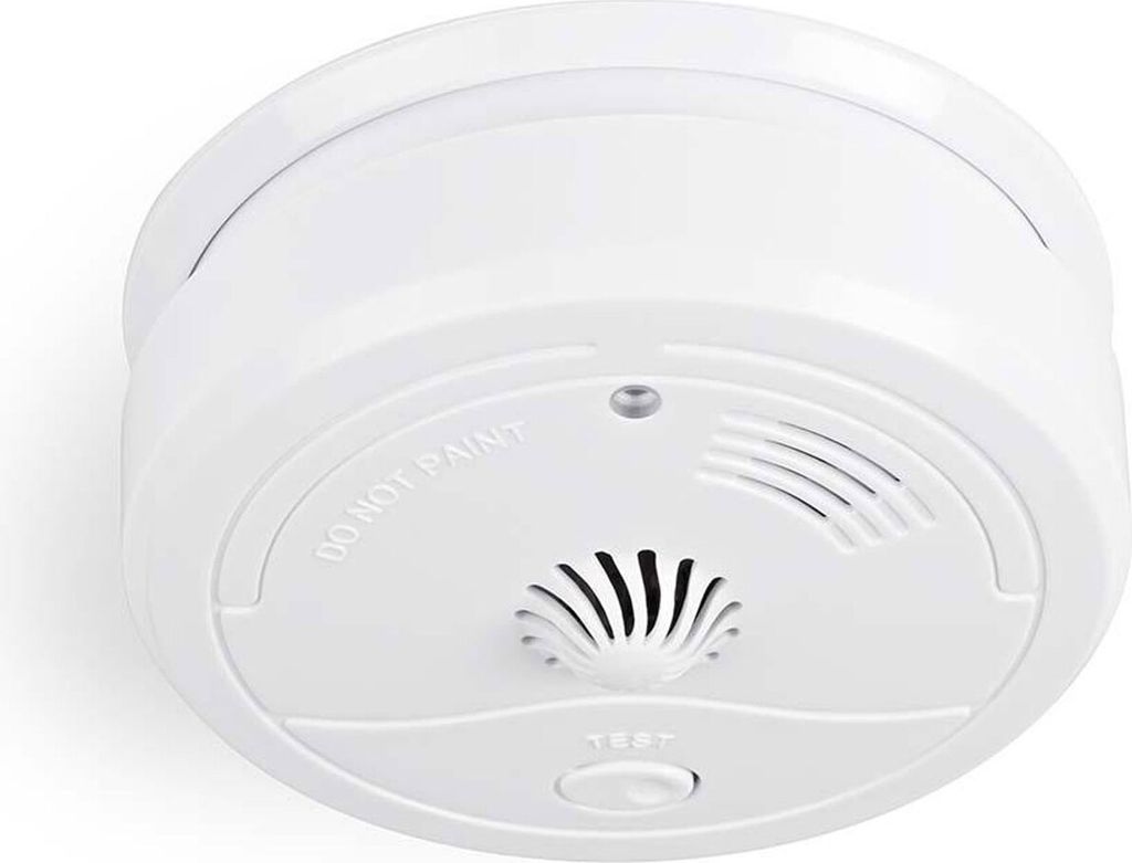 A white smoke detector is shown from a slightly elevated angle against a white background.