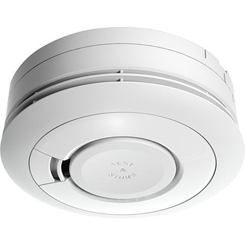 A white smoke detector is shown from a slightly elevated angle against a white background.