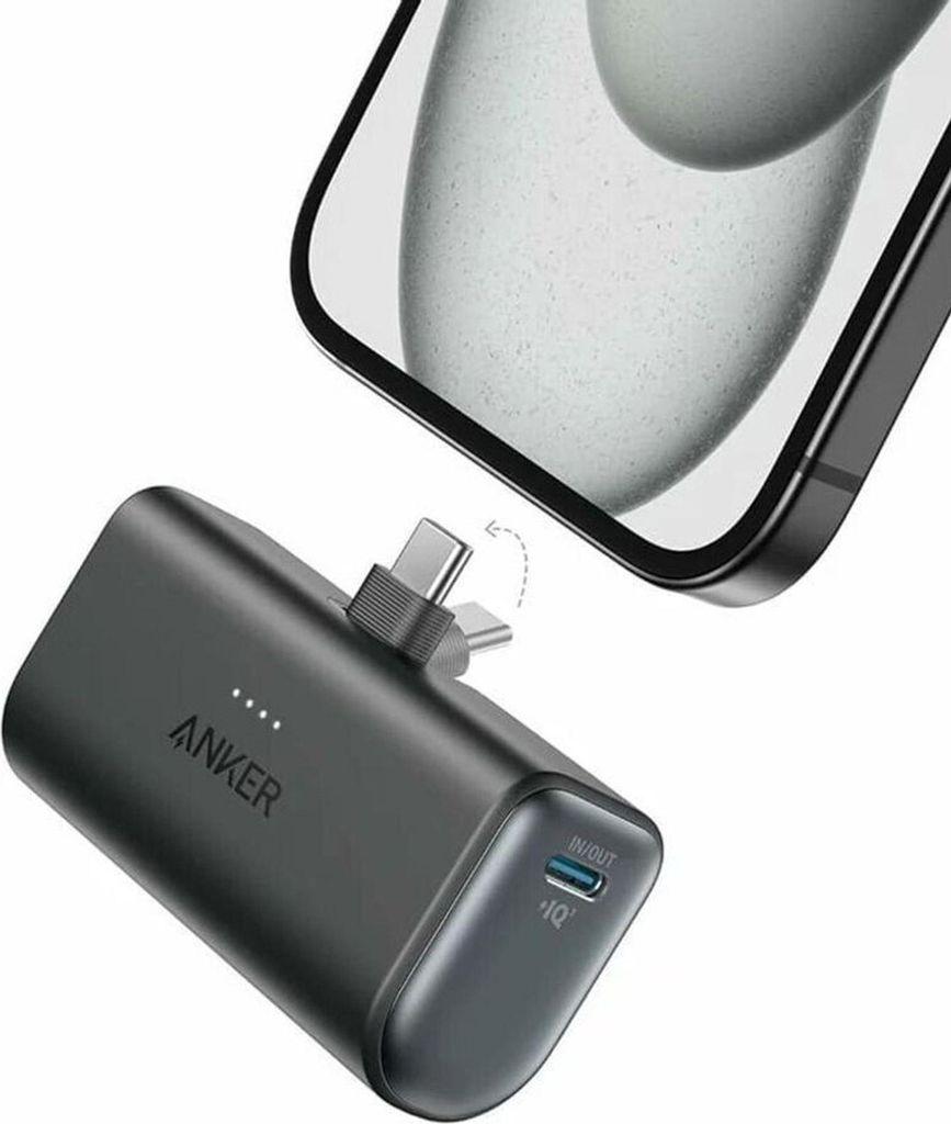 A black Anker Nano power bank is shown connected to a smartphone.