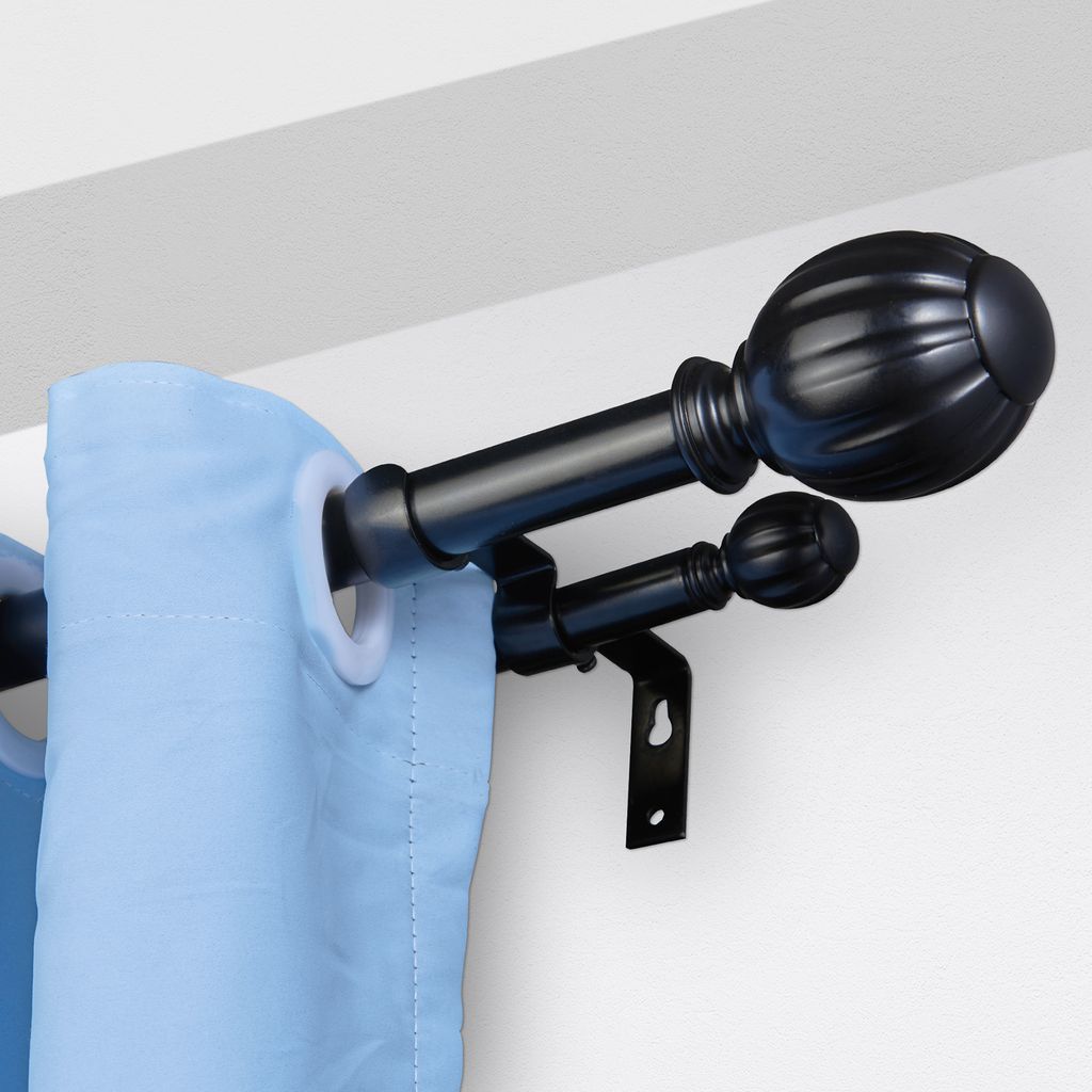 A close-up view of a double curtain rod with blue curtains.