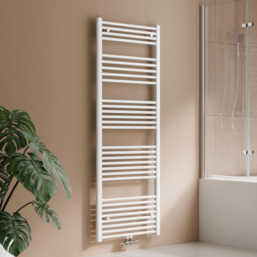 A white towel radiator is shown in a bathroom setting, next to a large potted plant and a shower enclosure.