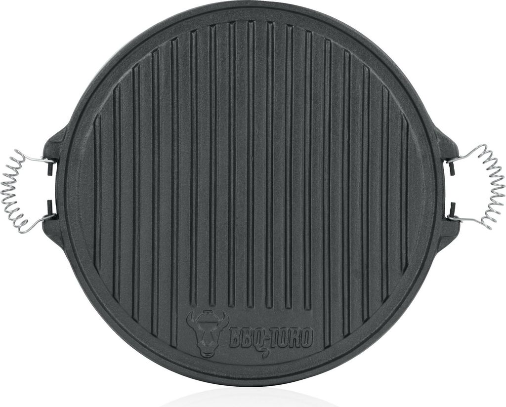 A top-down view of a round, black cast iron grill plate with ridged surface and two spring-like handles on the sides. A logo is visible at the bottom center.