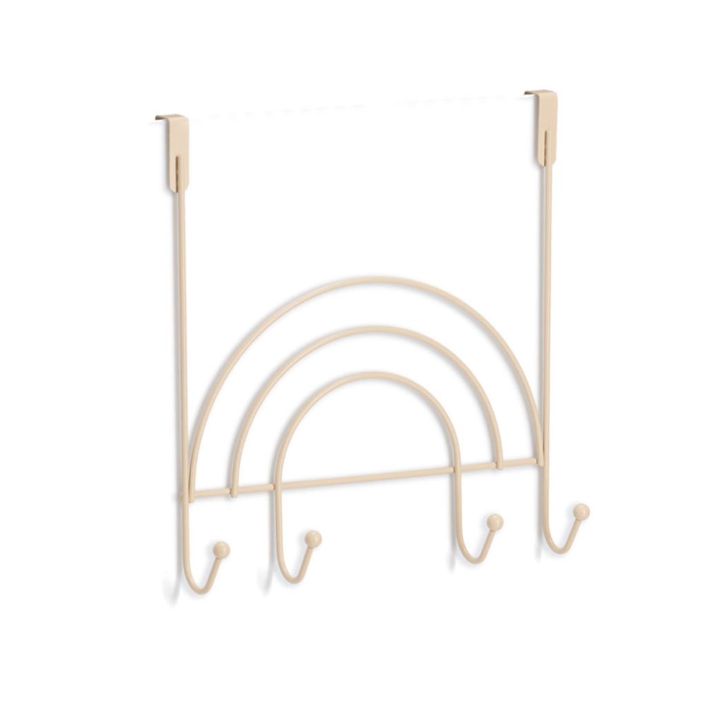A beige metal over-the-door hook rack shaped like a rainbow with three hooks.
