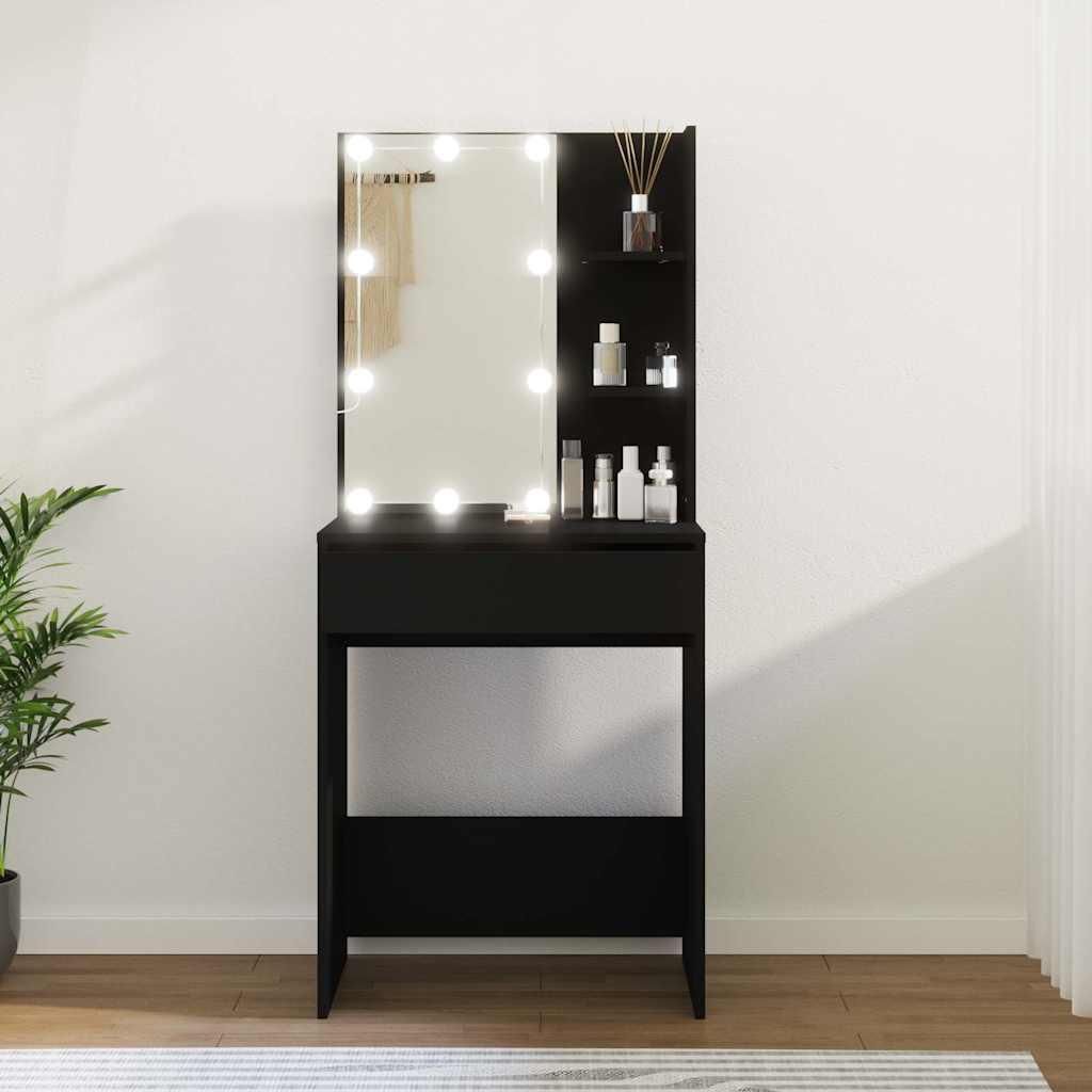 A black vanity table with a lighted mirror and shelves, set against a white wall.