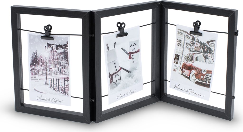 A black, tri-fold photo frame with wires and clips holding three small photos.