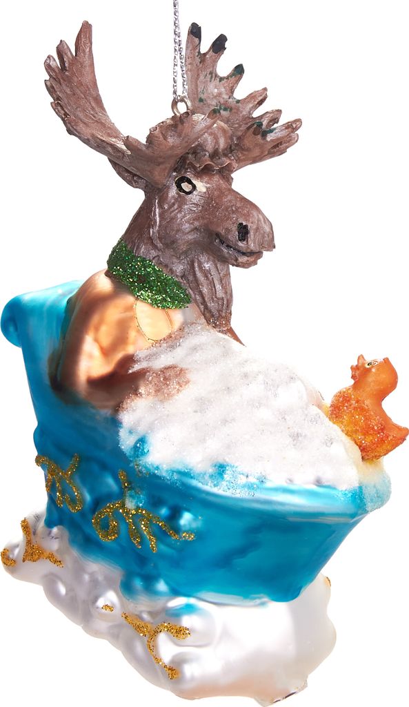 A glass ornament of a moose sitting in a bathtub with a rubber duck.