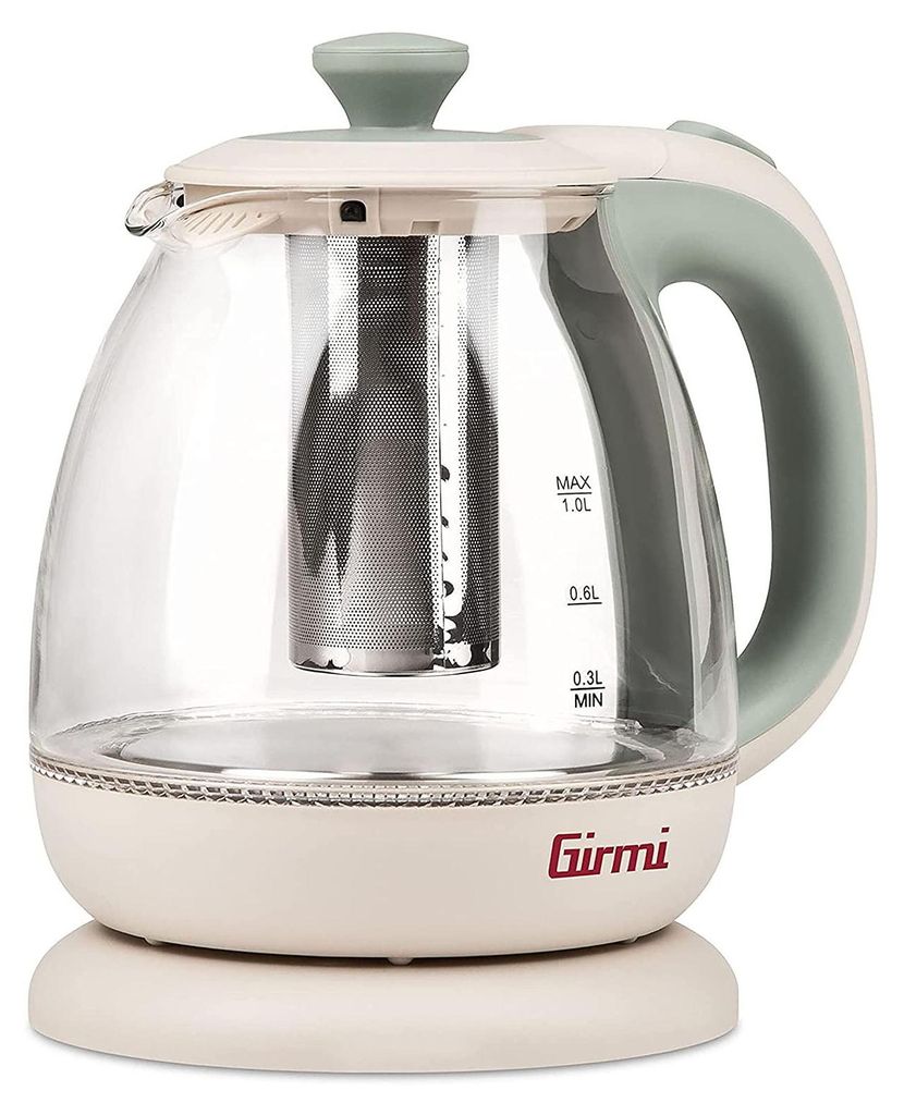 A transparent glass electric kettle with a cream base and handle, and a green lid and accents. It has a built-in infuser and water level markings.