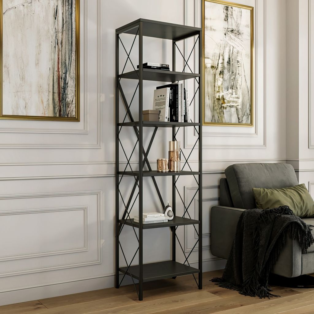 A tall, anthracite-colored bookshelf filled with books and decorative items, placed in a living room setting next to a sofa.