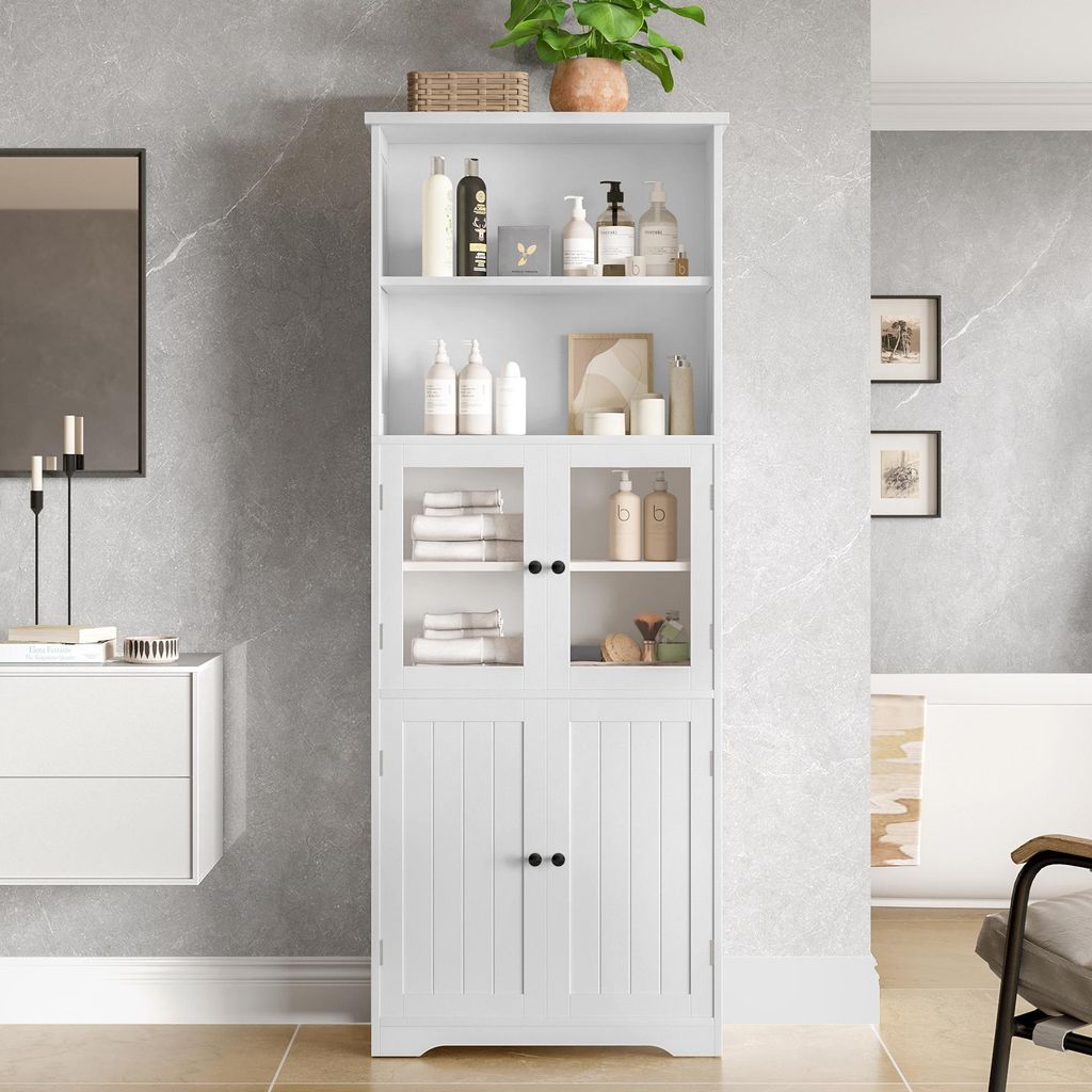 A white bathroom cabinet with glass doors and wooden doors, filled with toiletries and towels, is shown in a bathroom setting.