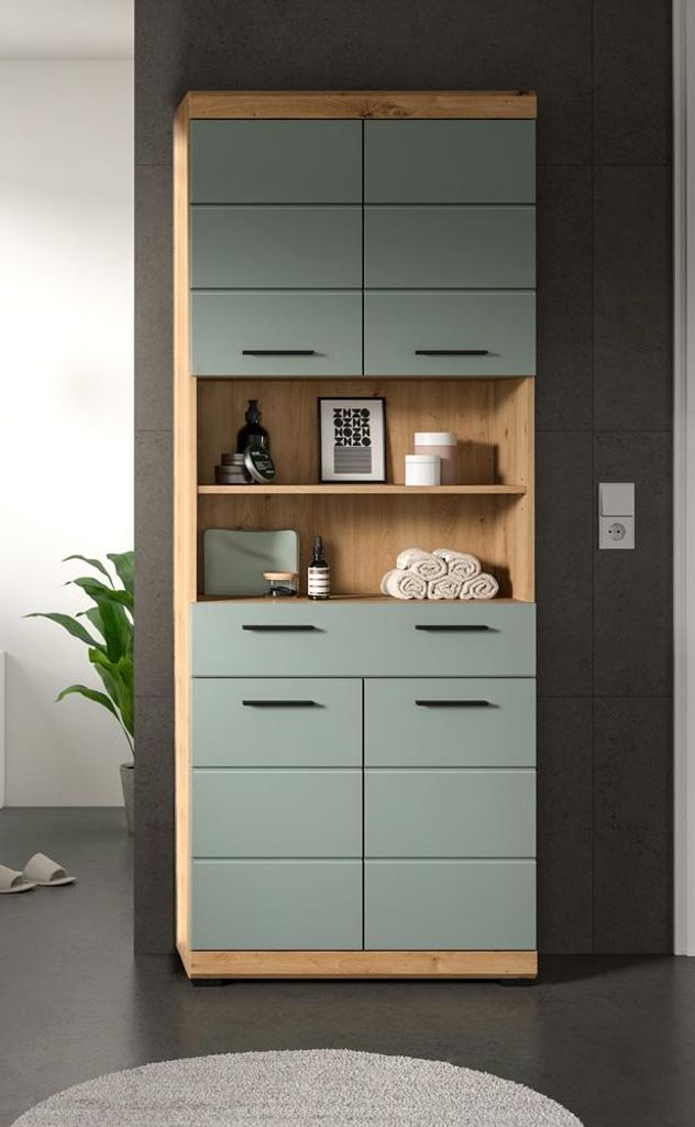 A tall cabinet with green doors and wooden accents, placed in a bathroom setting.