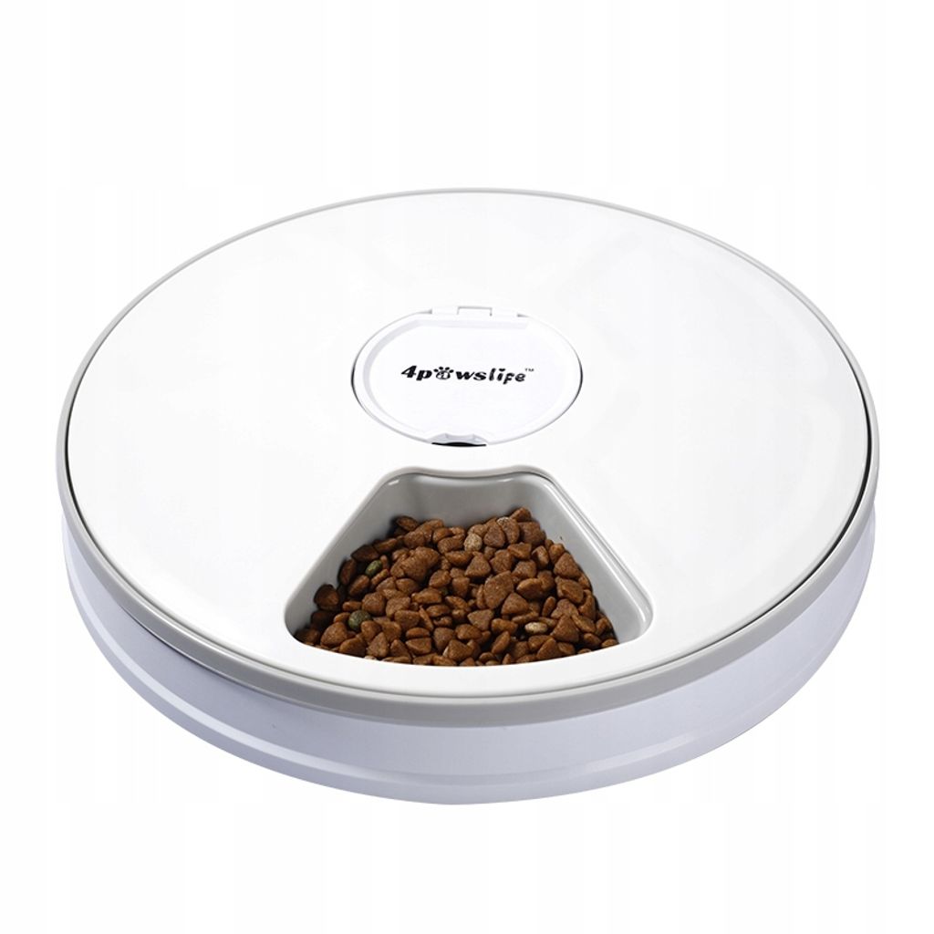 A white automatic pet feeder with a gray rim, filled with brown kibble in one of its compartments.