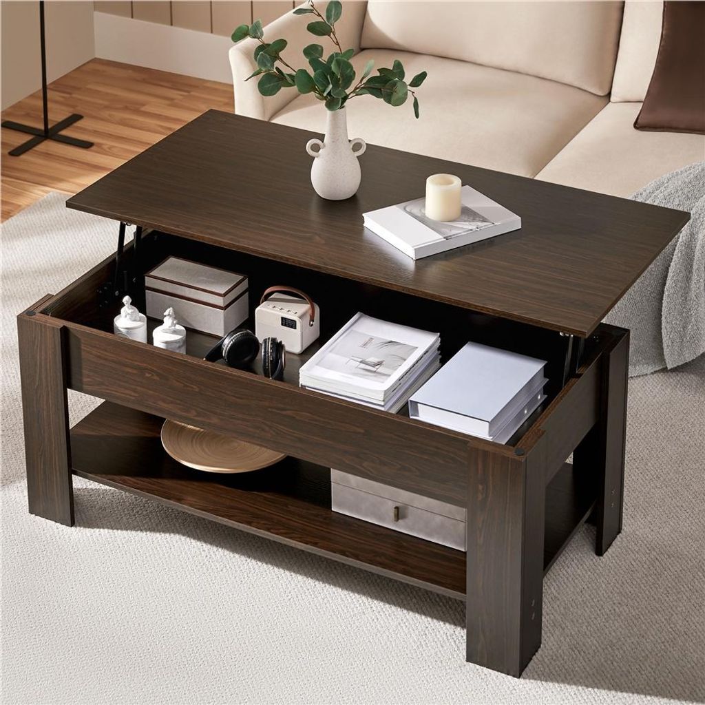 A dark brown lift-top coffee table with storage, shown in a living room setting with a couch in the background.