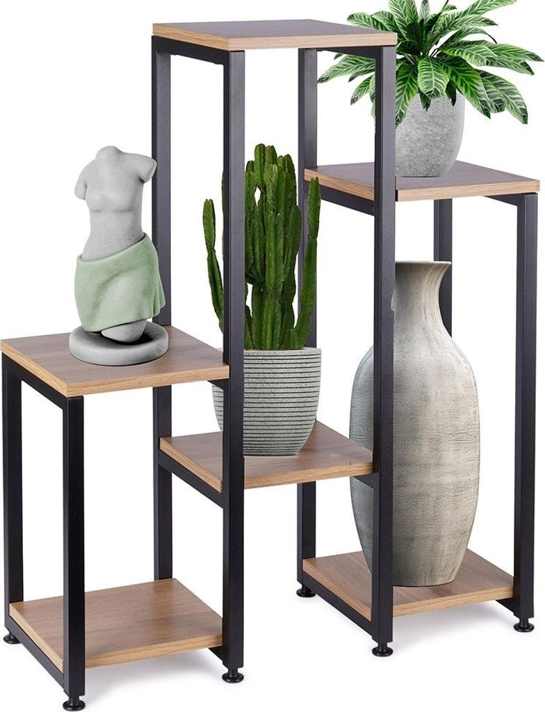 A multi-tiered plant stand displaying decorative items and plants.