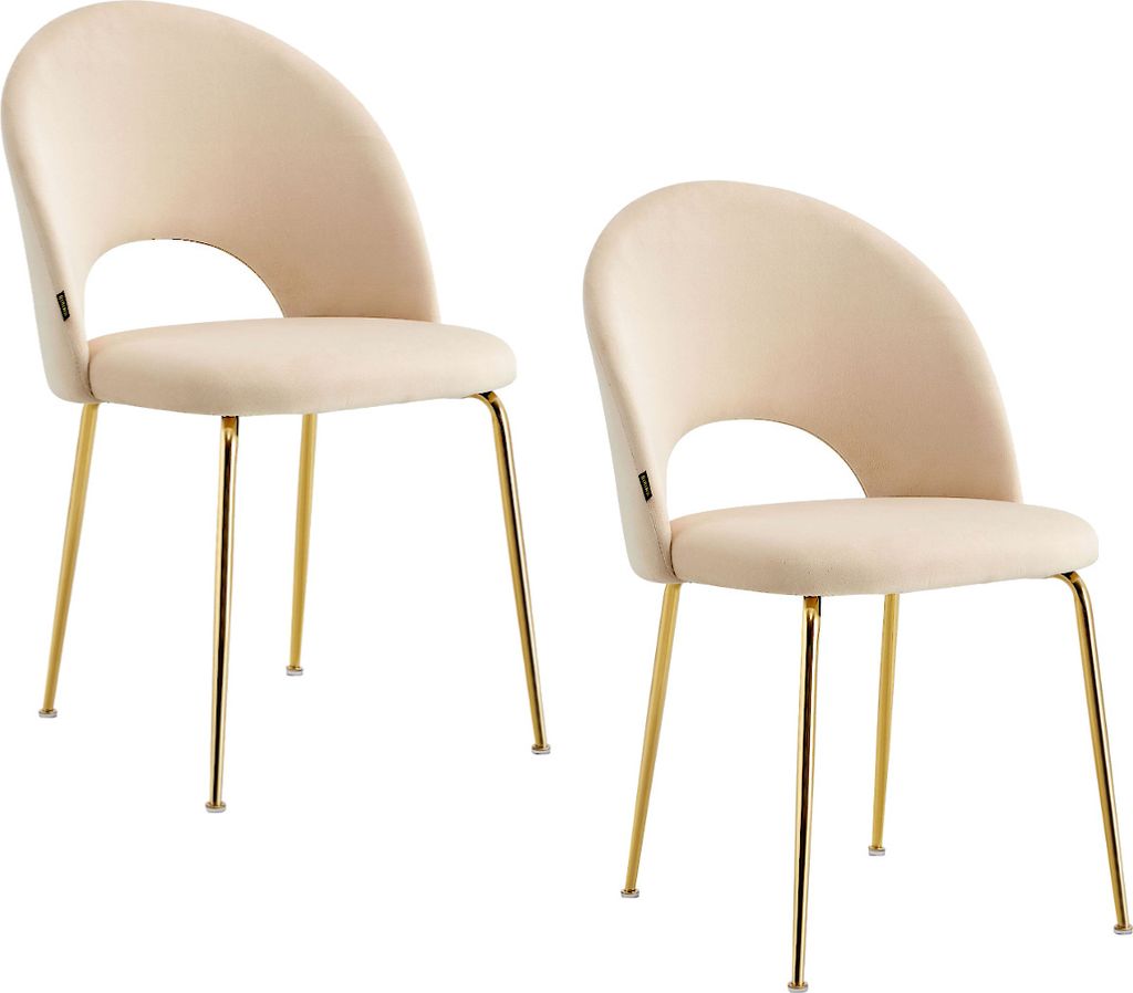Two beige upholstered dining chairs with gold metal legs are shown against a white background.
