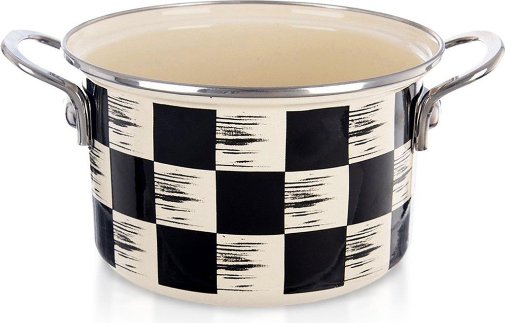 A close-up studio shot of a black and white checkered enamel pot.