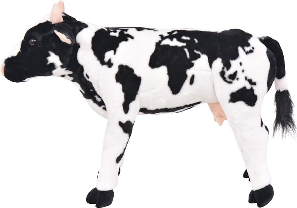A stuffed toy cow with a black and white world map pattern.